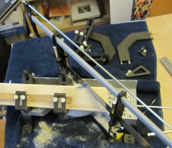 a piece of wood being sawed using the clamps